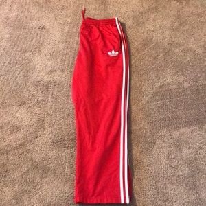 Red adidas track pants